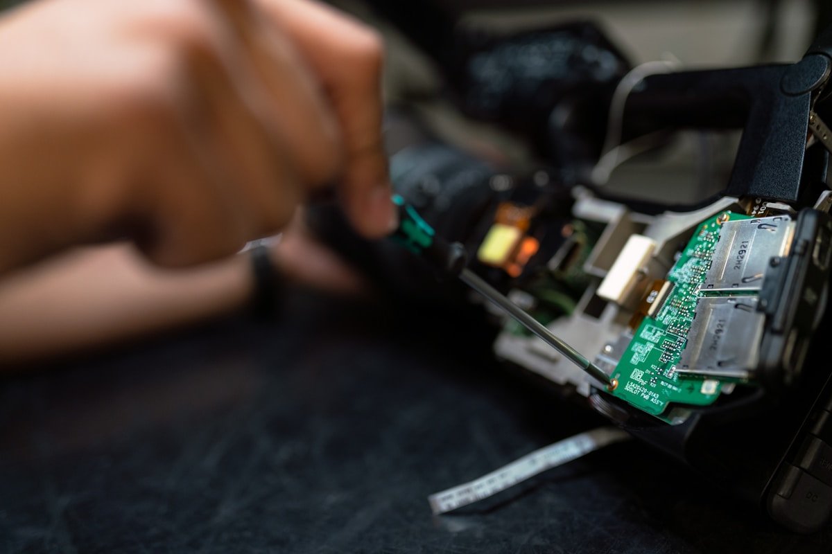 HVAC technician checking electrical wiring and control components on a residential heating and cooling system