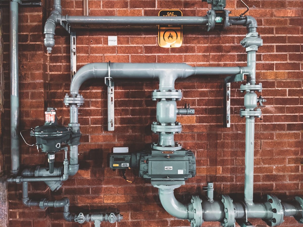 Professional residential HVAC technician equipped with diagnostic tools for home heating and cooling service